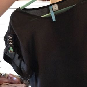Black shirt with beaded sleeves